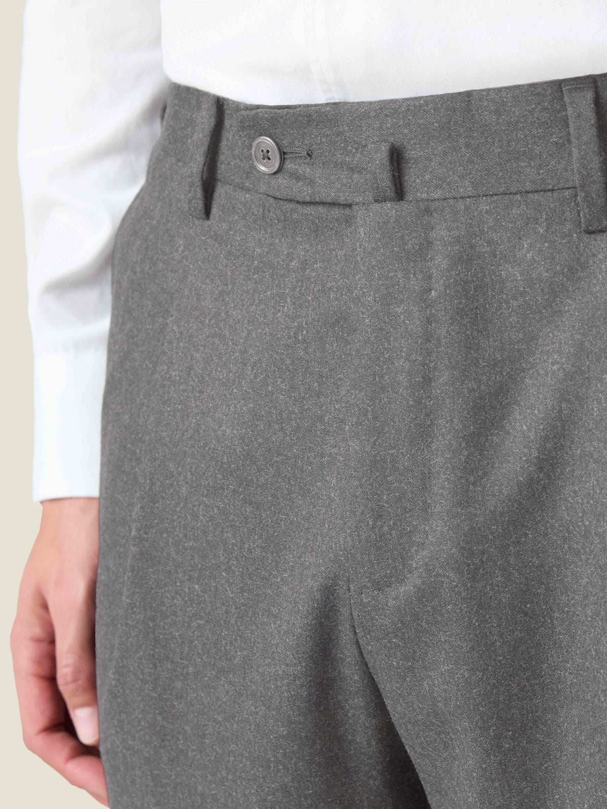 Close-up of the waistband on the Luca Faloni Light Grey Wool Suit trousers, showing the texture of the virgin wool fabric.