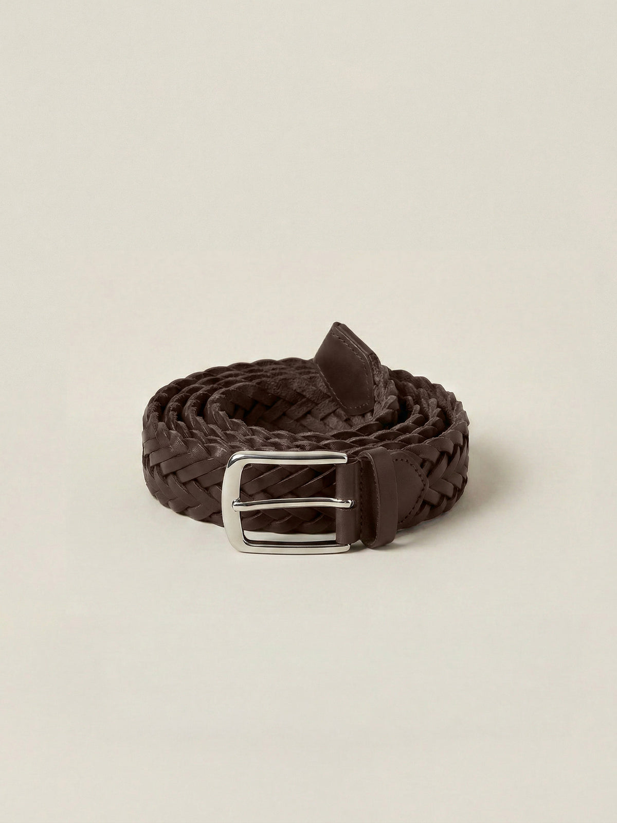 Chocolate brown Western Calf Leather Belt with a woven texture and silver-toned buckle, coiled on a light background.