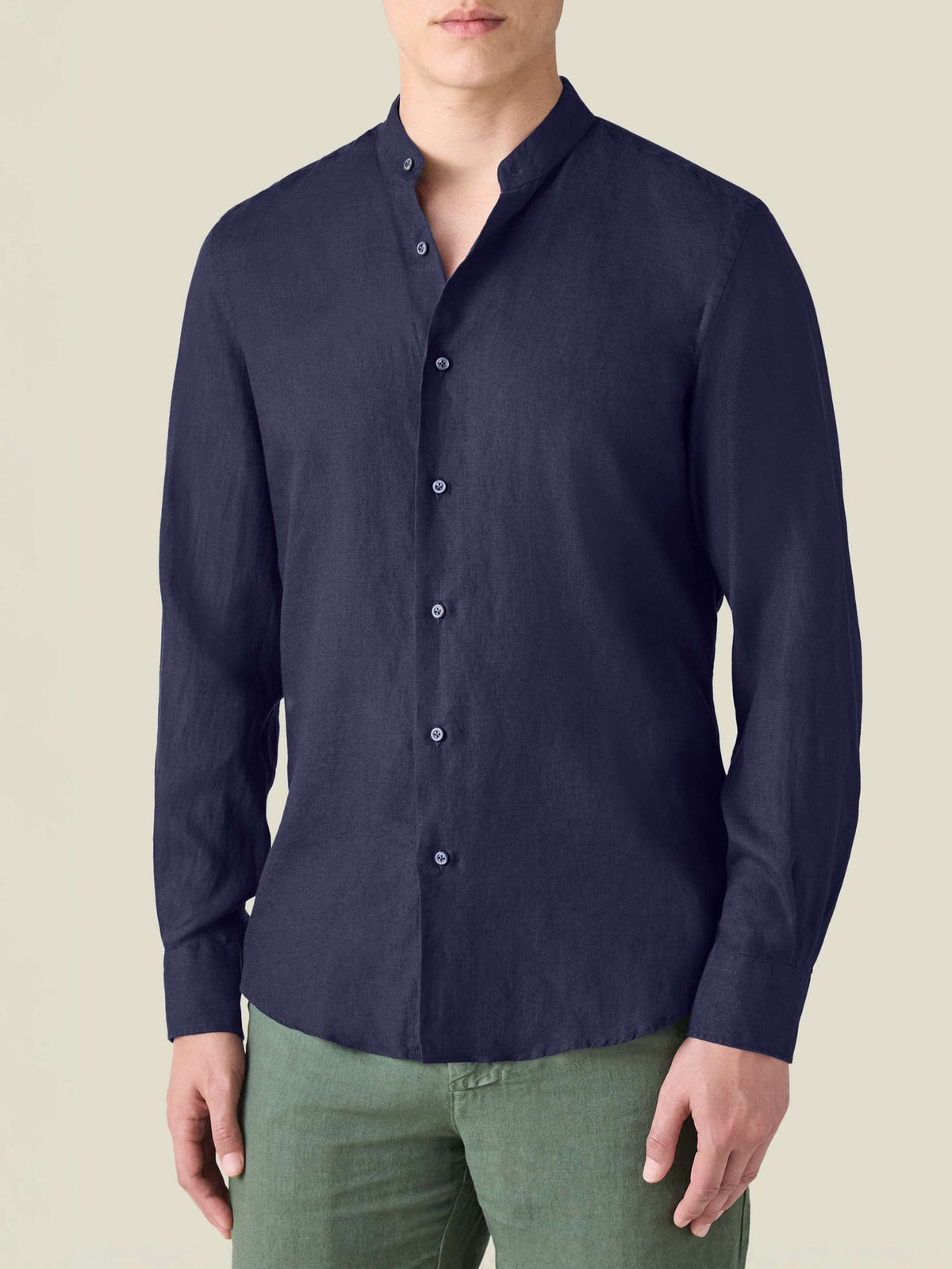 Midnight blue Versilia Italian linen shirt with a band collar, worn by a model on a neutral background.