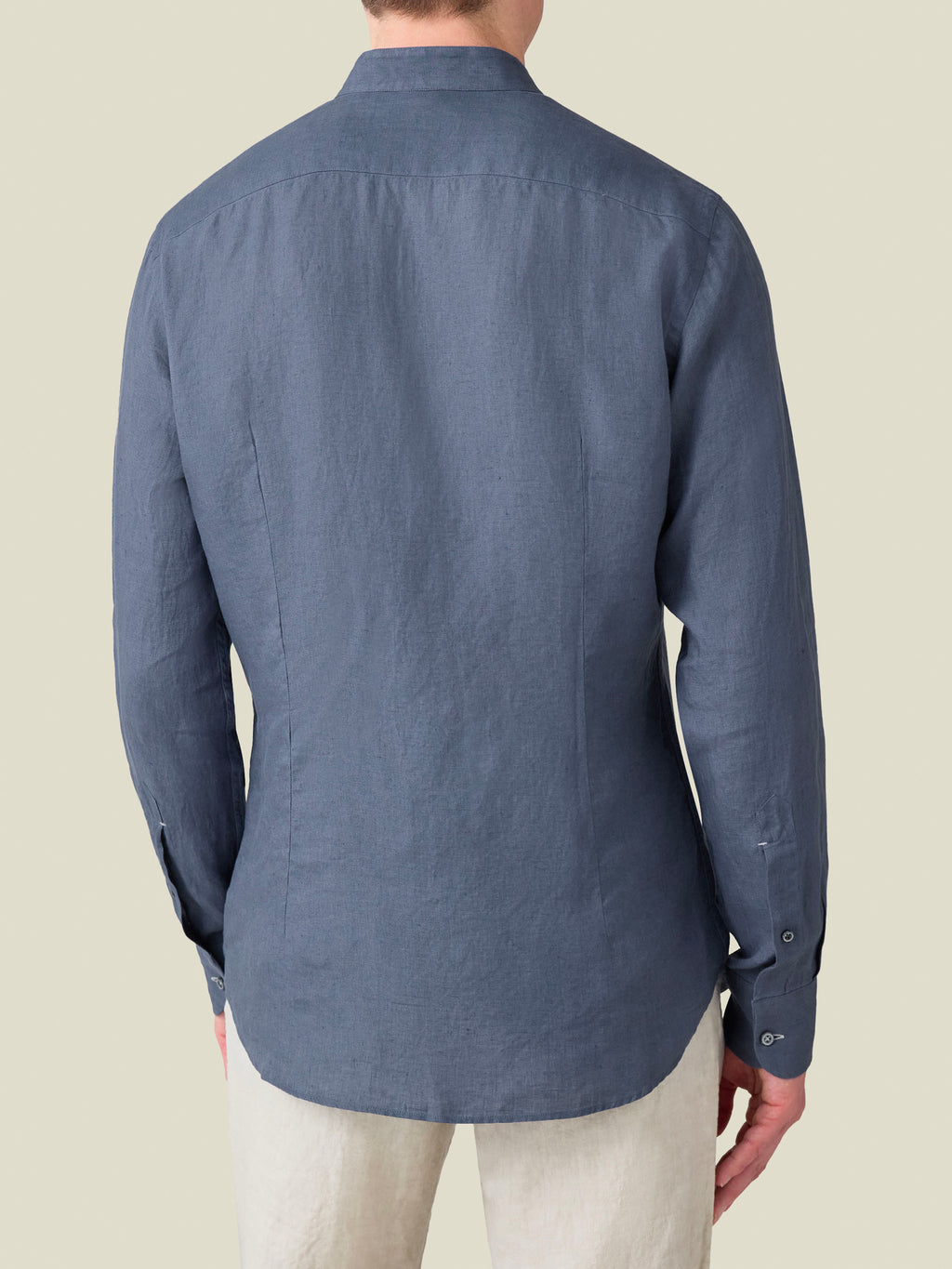 Back view of the Payne's Grey Versilia Linen Shirt with a band collar, worn by a model against a neutral background.