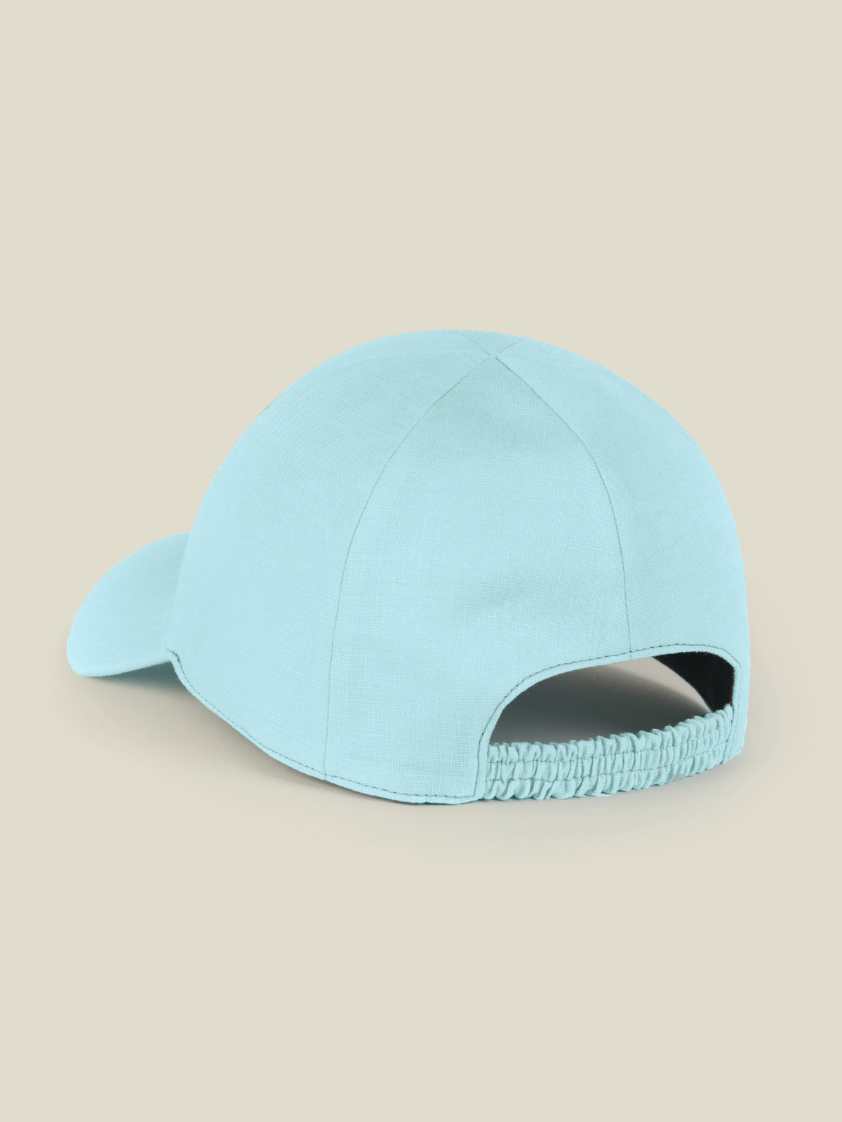 Back view of the Junior Linen Baseball Cap in Aquamarine showing the elasticated strap.