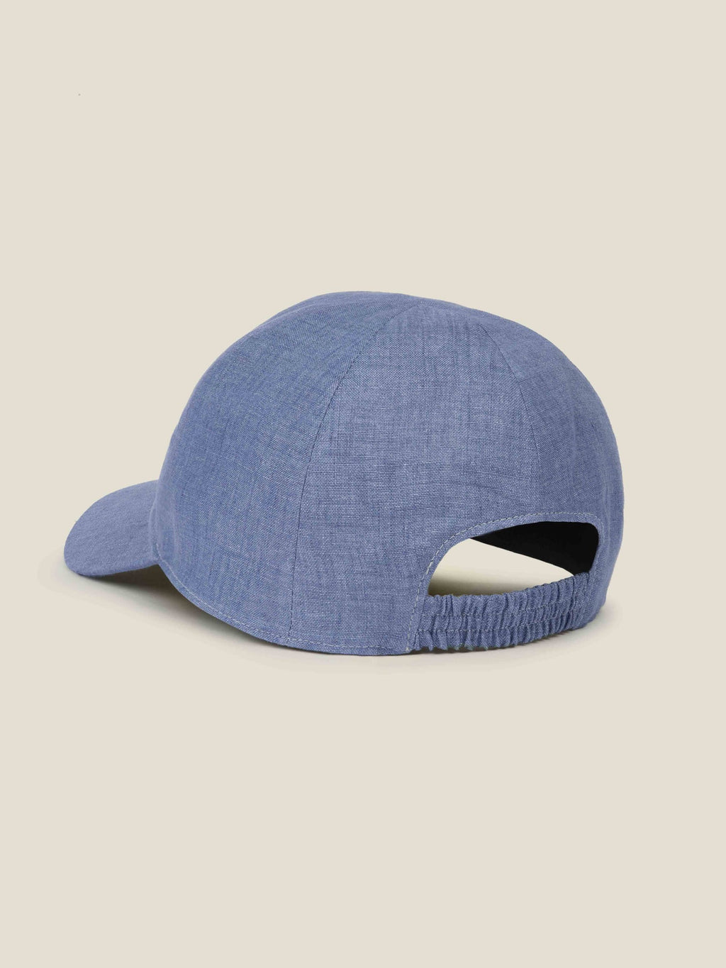 Rear view of the Chambray Blue Linen Baseball Cap, showcasing the comfortable elasticated back strap.