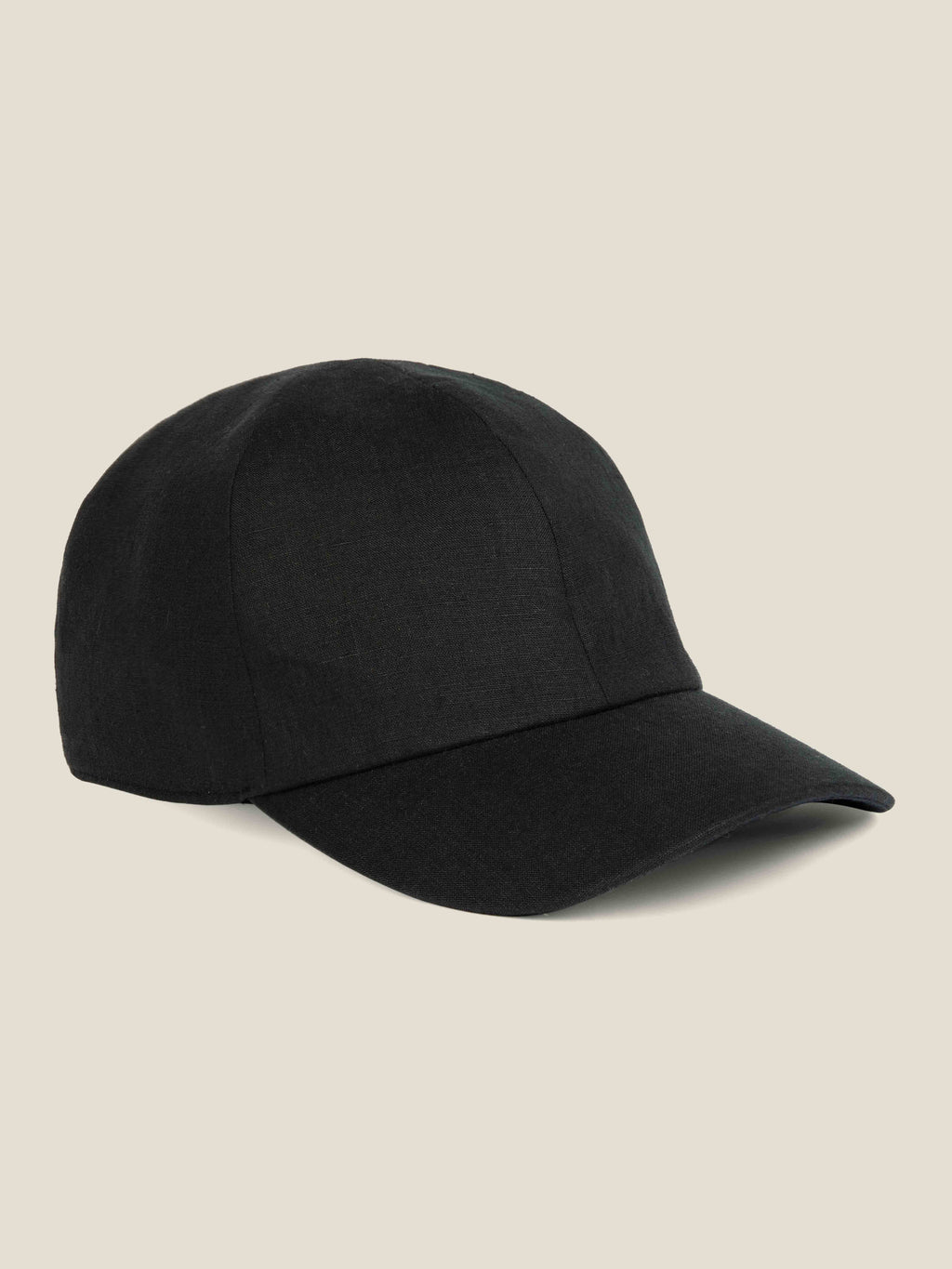 A side view of the Luca Faloni black Linen Baseball Cap, showcasing its classic shape and linen texture.