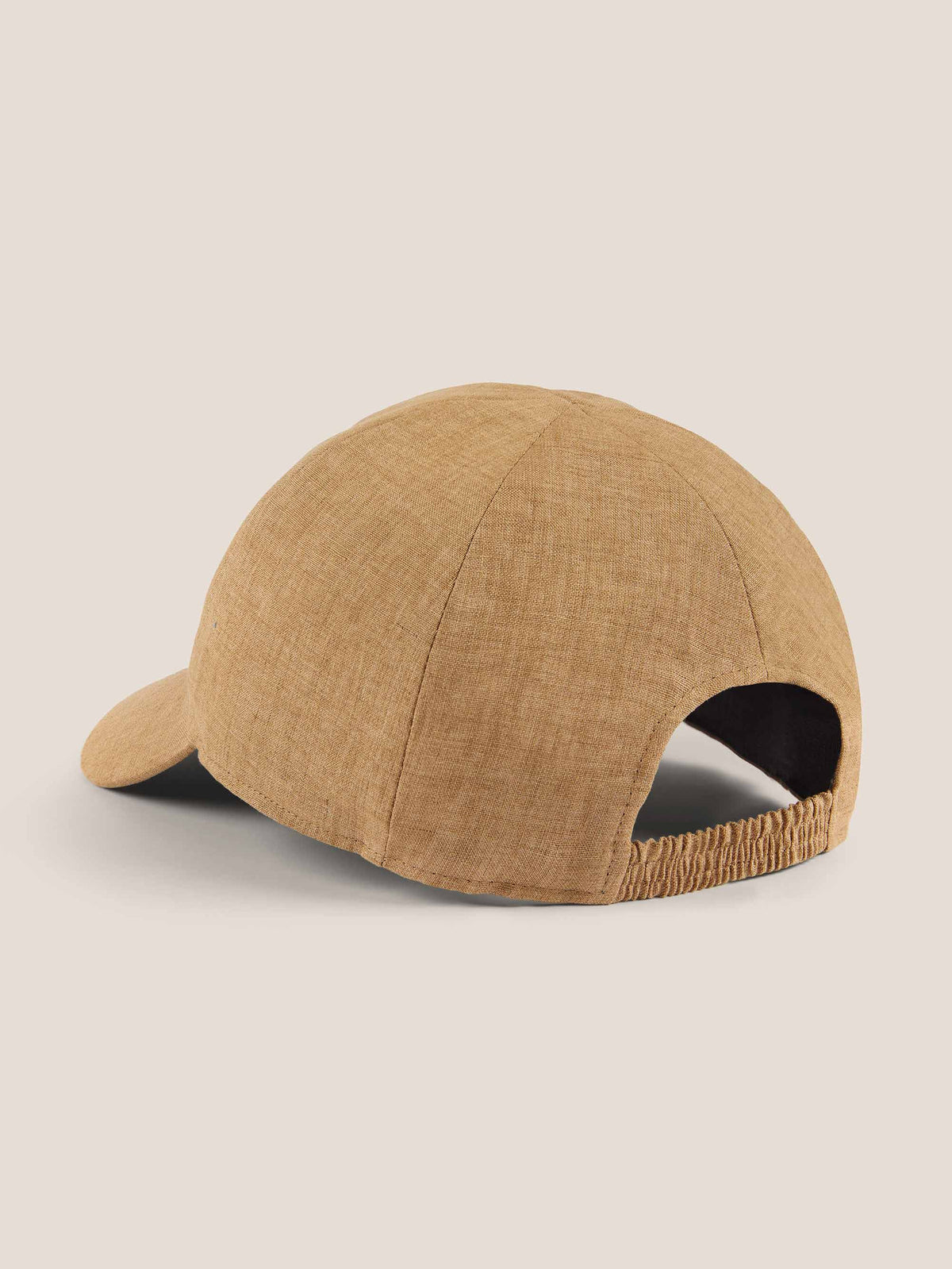 Rear view of the Caramel Brown Linen Baseball Cap, showing the elasticated back strap and fine linen texture.