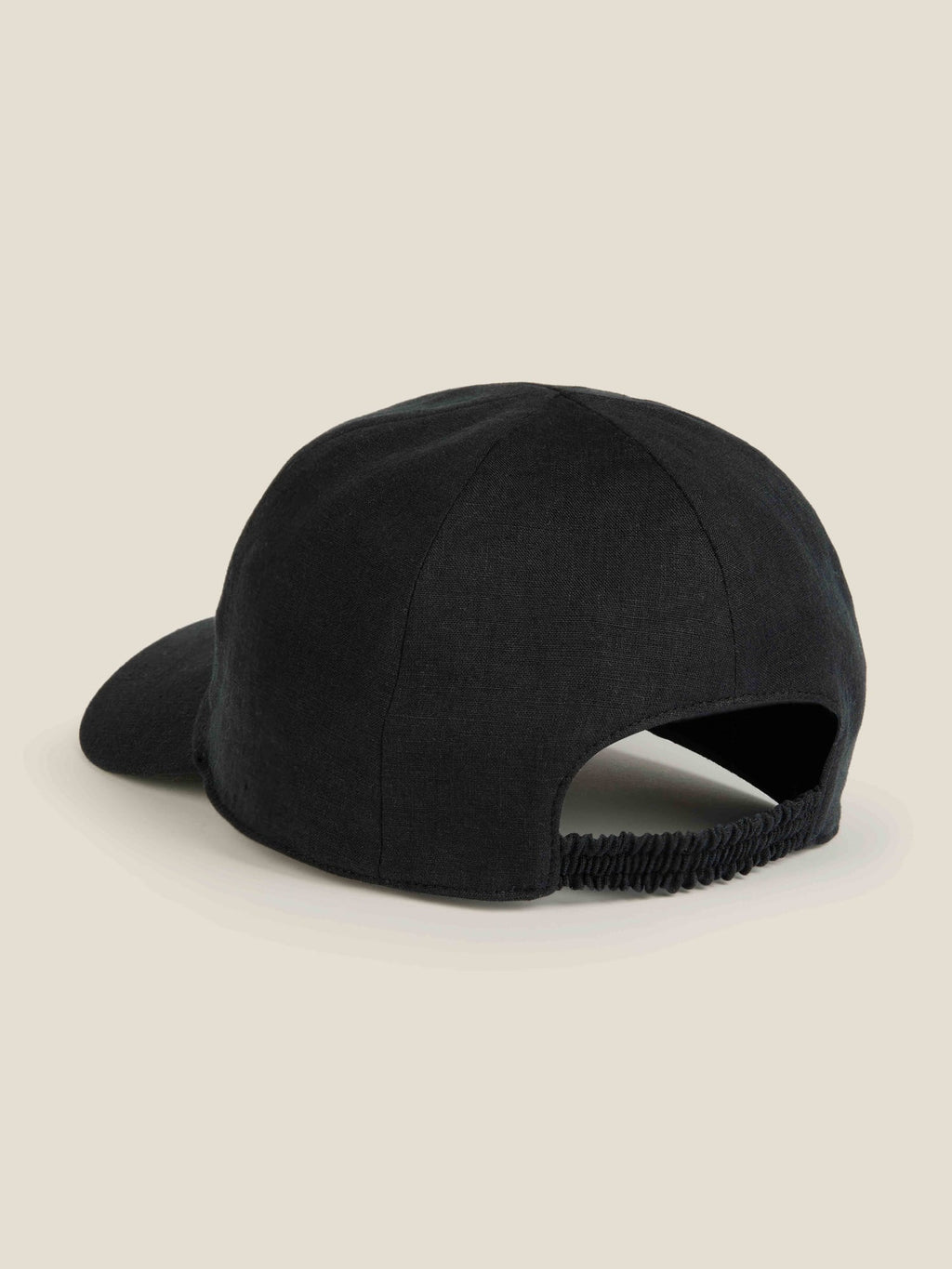 Back view of the Luca Faloni black linen baseball cap, highlighting the elasticated back strap and six-panel construction.
