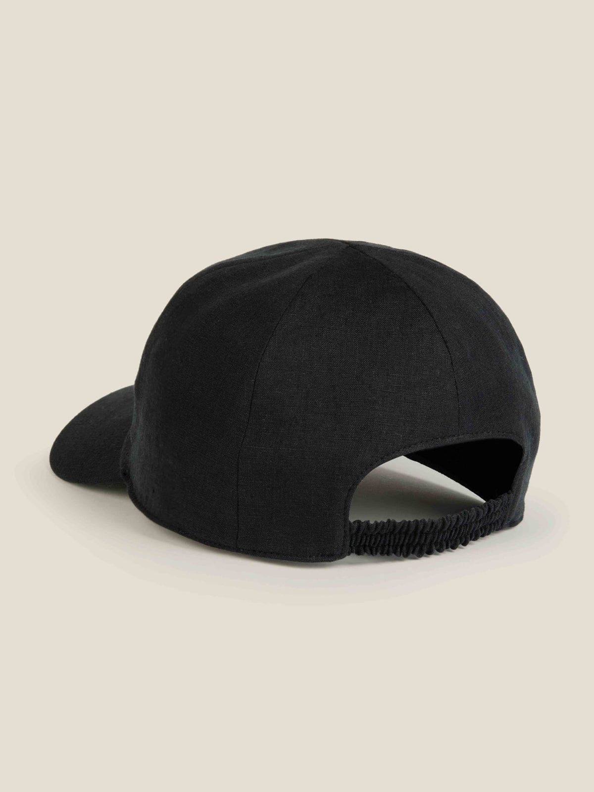 Back view of the Luca Faloni black linen baseball cap, highlighting the elasticated back strap and six-panel construction.