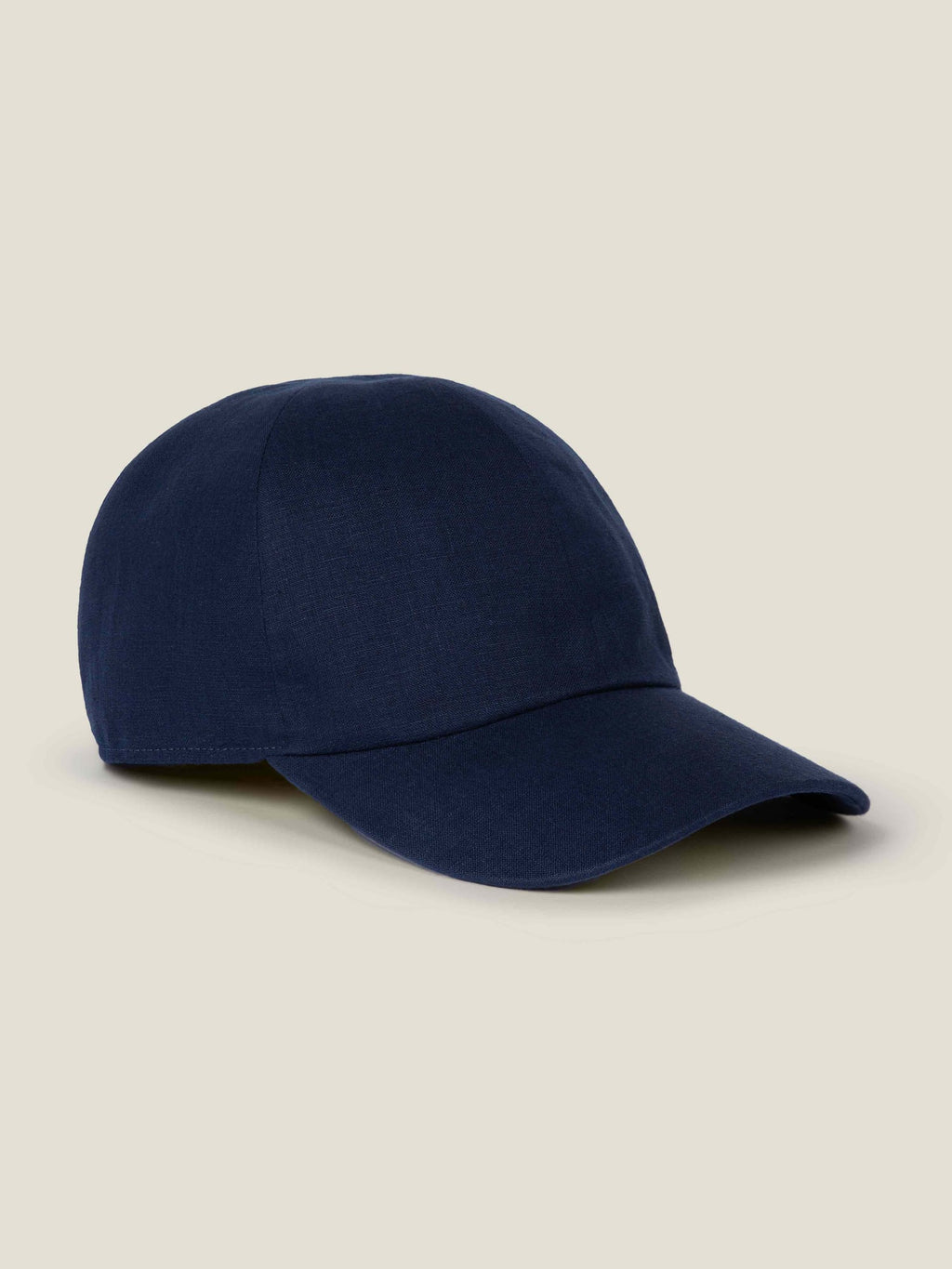 A side profile of the Luca Faloni Linen Baseball Cap in Midnight Blue.