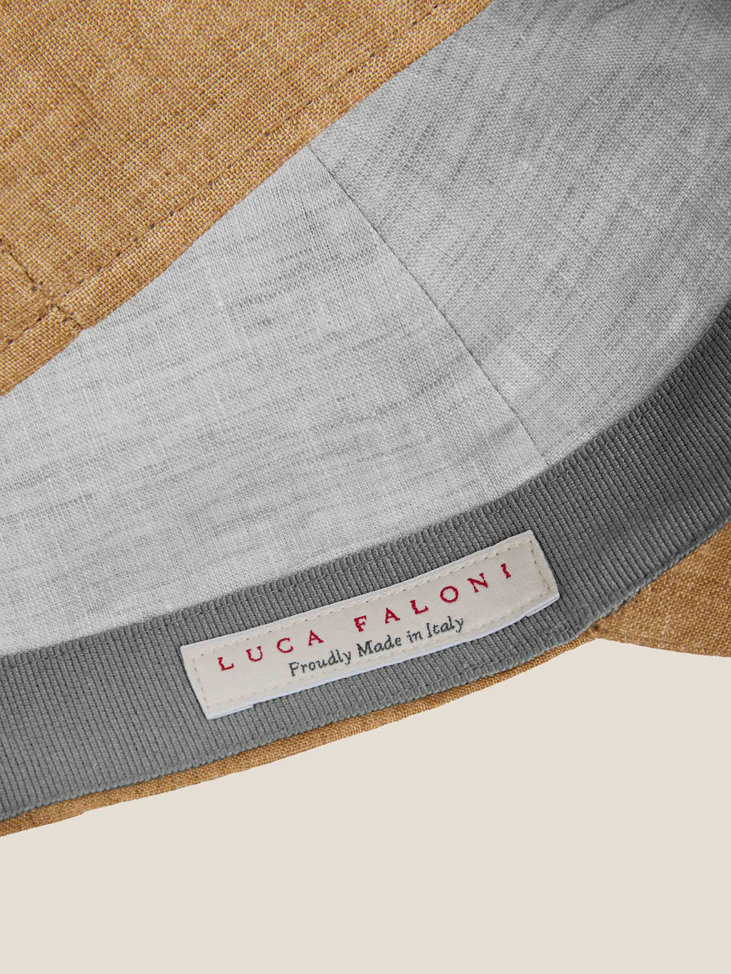 Close-up of the Caramel Brown Linen Baseball Cap, showing the grey linen inner lining and Luca Faloni brand label.