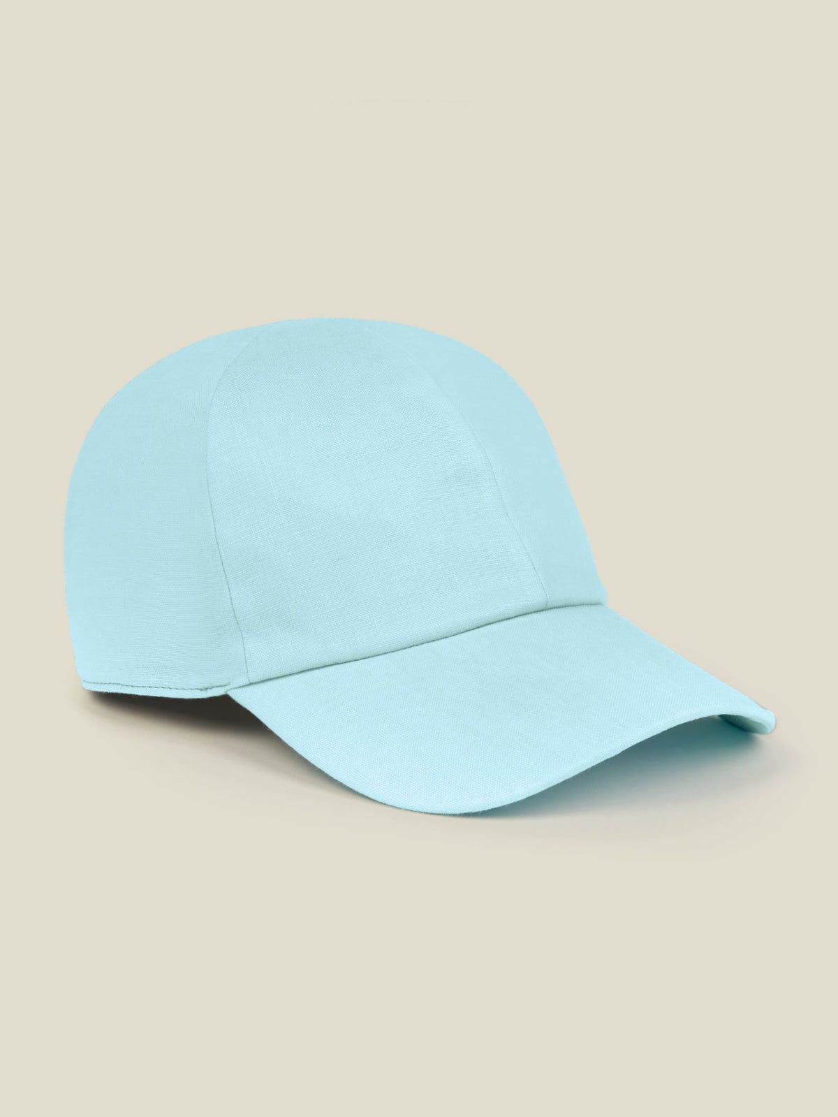 A studio shot of the Luca Faloni Linen Baseball Cap in aquamarine, viewed from the side.