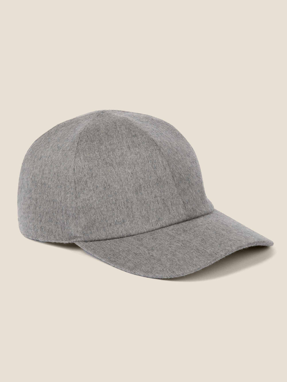 Studio shot of the Luca Faloni light grey cashmere baseball cap. The hat is shown from a three-quarter angle.