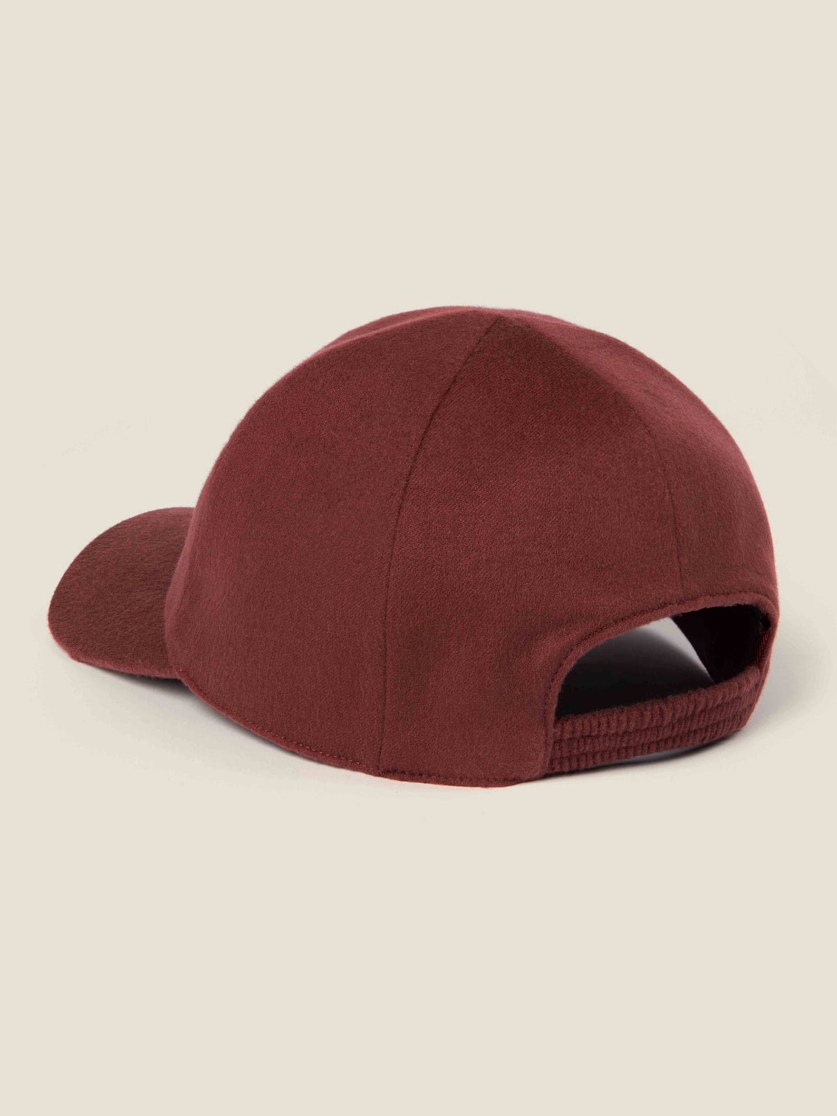 Back view of the Luca Faloni rust cashmere baseball cap, showing the elasticated strap.