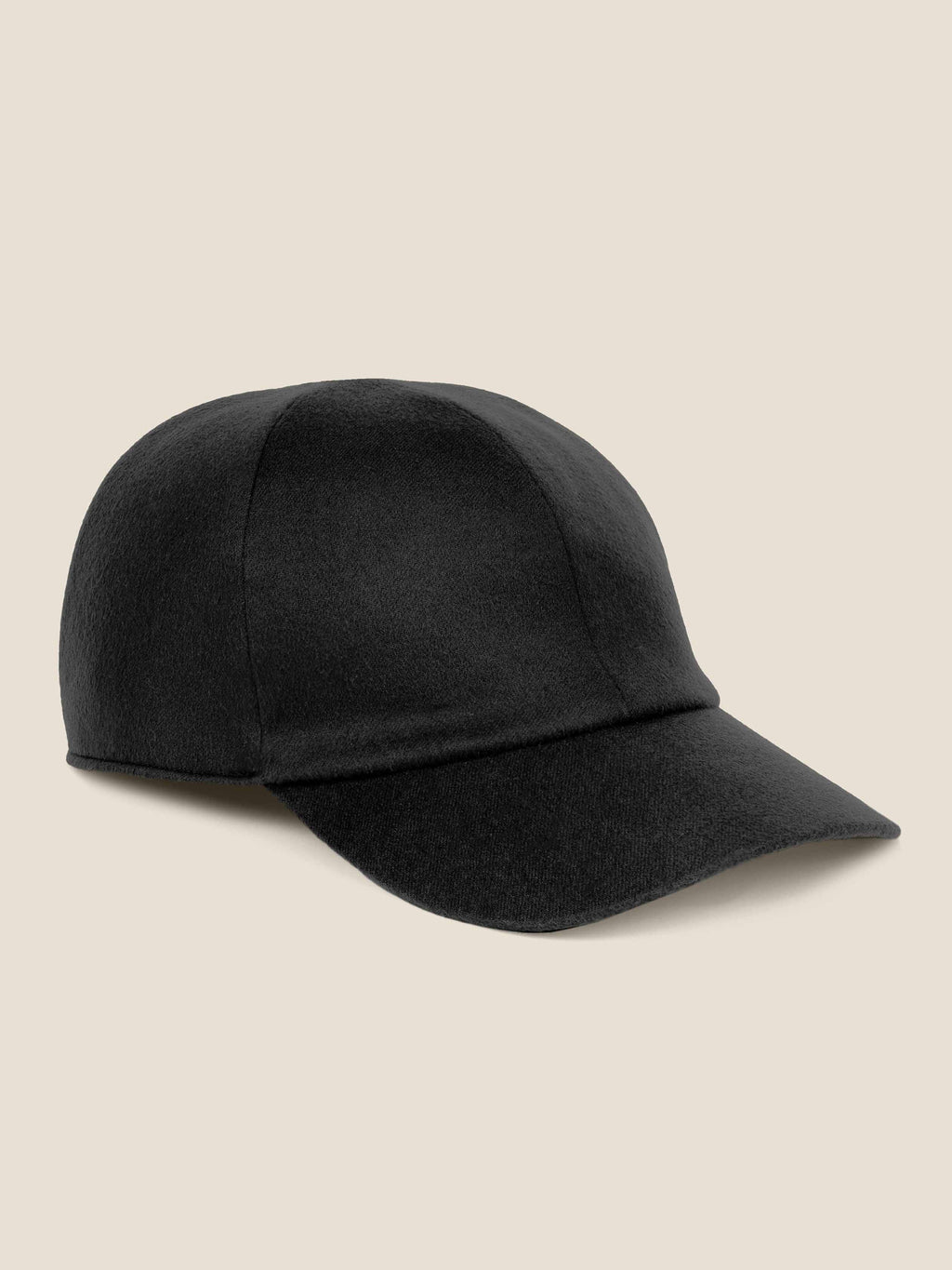 Side view of the black cashmere Baseball Cap by Luca Faloni on a plain background.