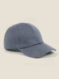 A side view of the Luca Faloni cashmere baseball cap in whale blue on a plain background.