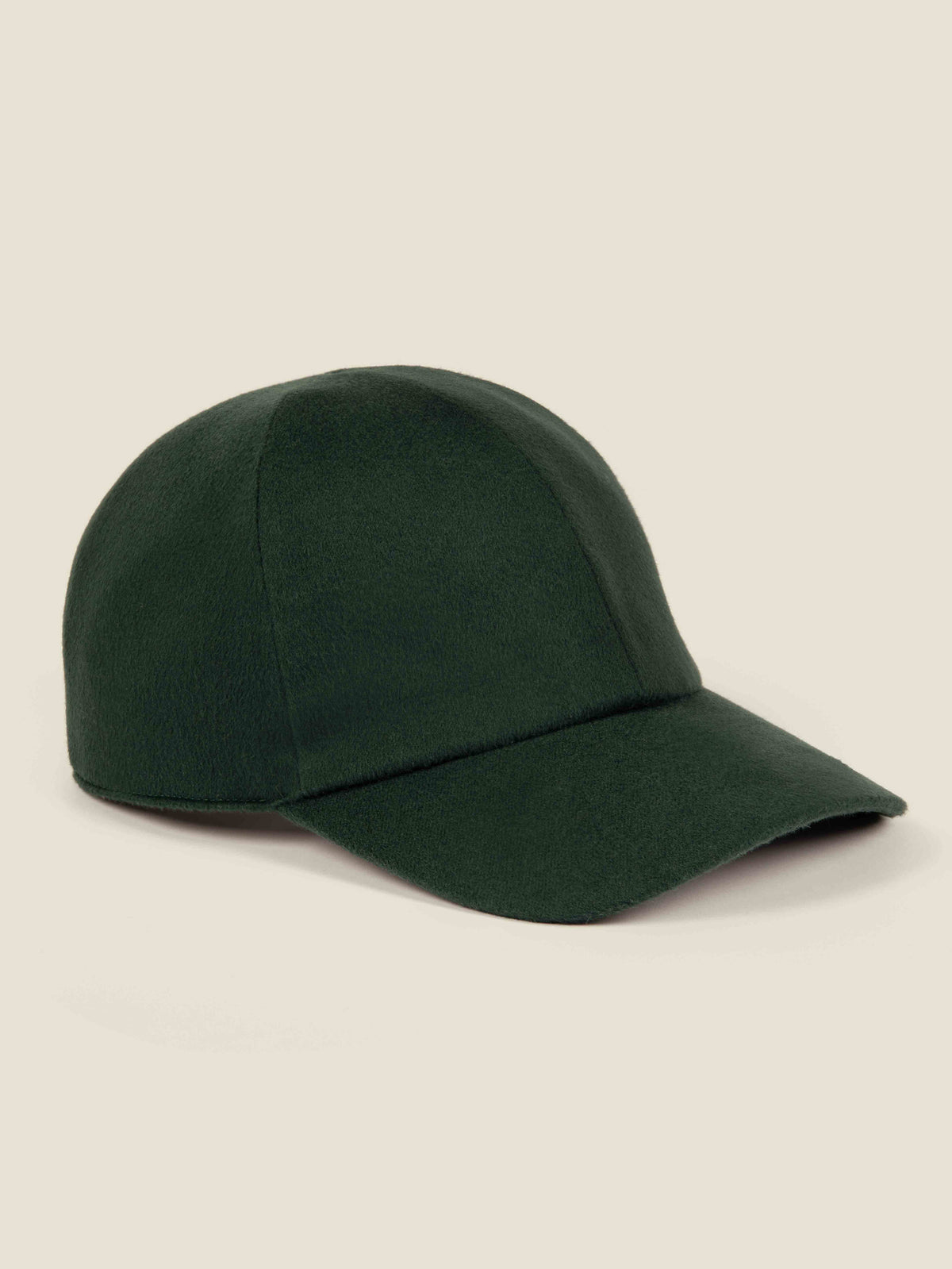 Side profile of the Luca Faloni Cashmere Baseball Cap in Forest Green.