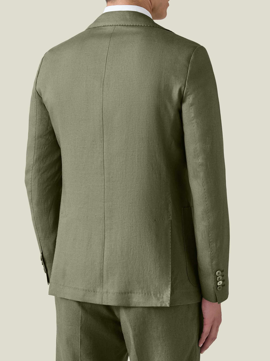 A model seen from the back wearing the Luca Faloni Olive Green Linen Blazer, highlighting its slim, tailored fit.
