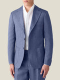 Front view of a model wearing Luca Faloni's Azure Linen Blazer over a white shirt with matching trousers.