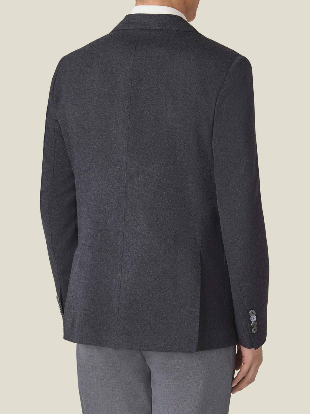 Back view of a model wearing the Luca Faloni Cashmere Blazer in Charcoal Grey, showcasing its slim fit.