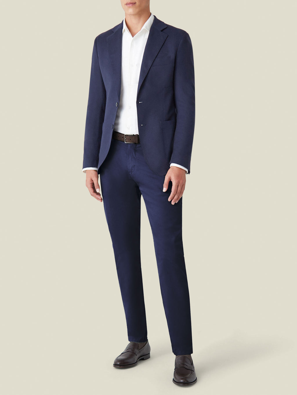 Front view of a model wearing the Navy Blue Cashmere Blazer with matching navy trousers, a white shirt, and dark loafers.