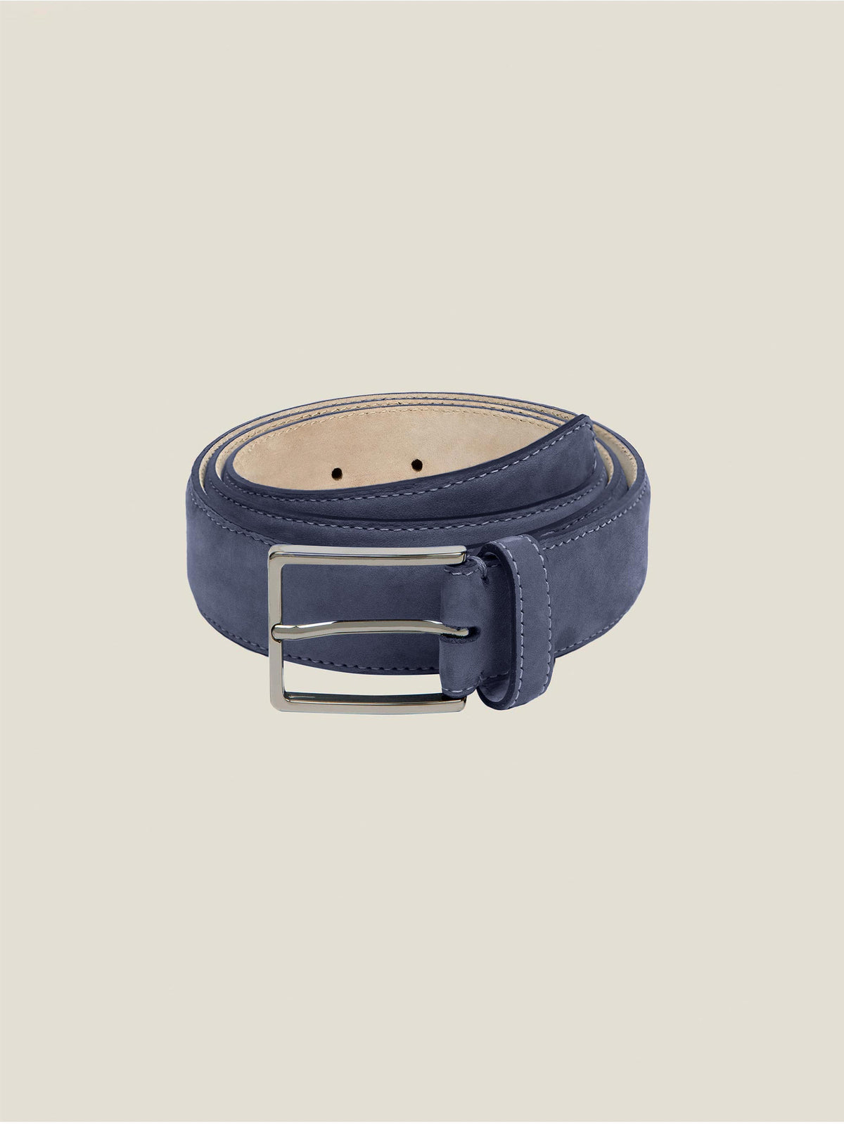 A coiled navy blue nubuck leather belt with a single-prong silver buckle against a neutral background.