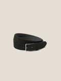A coiled view of the Luca Faloni Classic Suede Belt in Black, highlighting its soft suede and silver buckle.
