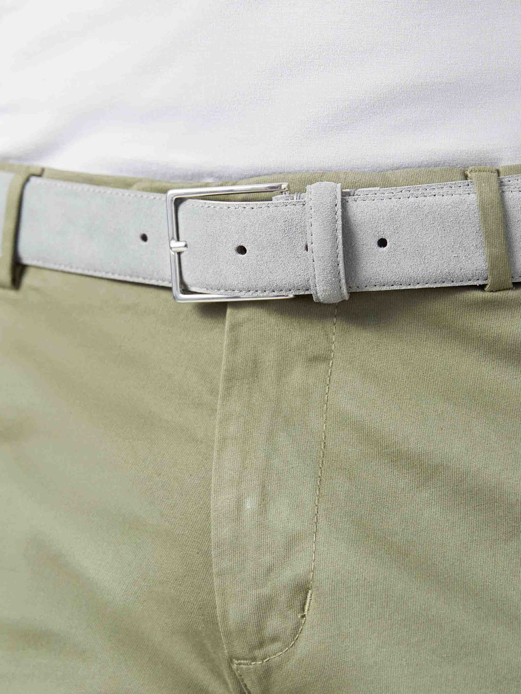 Close-up of a model wearing the French Blue Classic Suede Belt with khaki chinos.