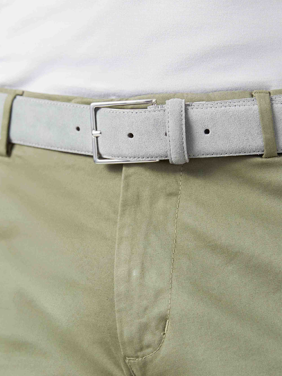 Close-up of a model wearing the French Blue Classic Suede Belt with khaki chinos.