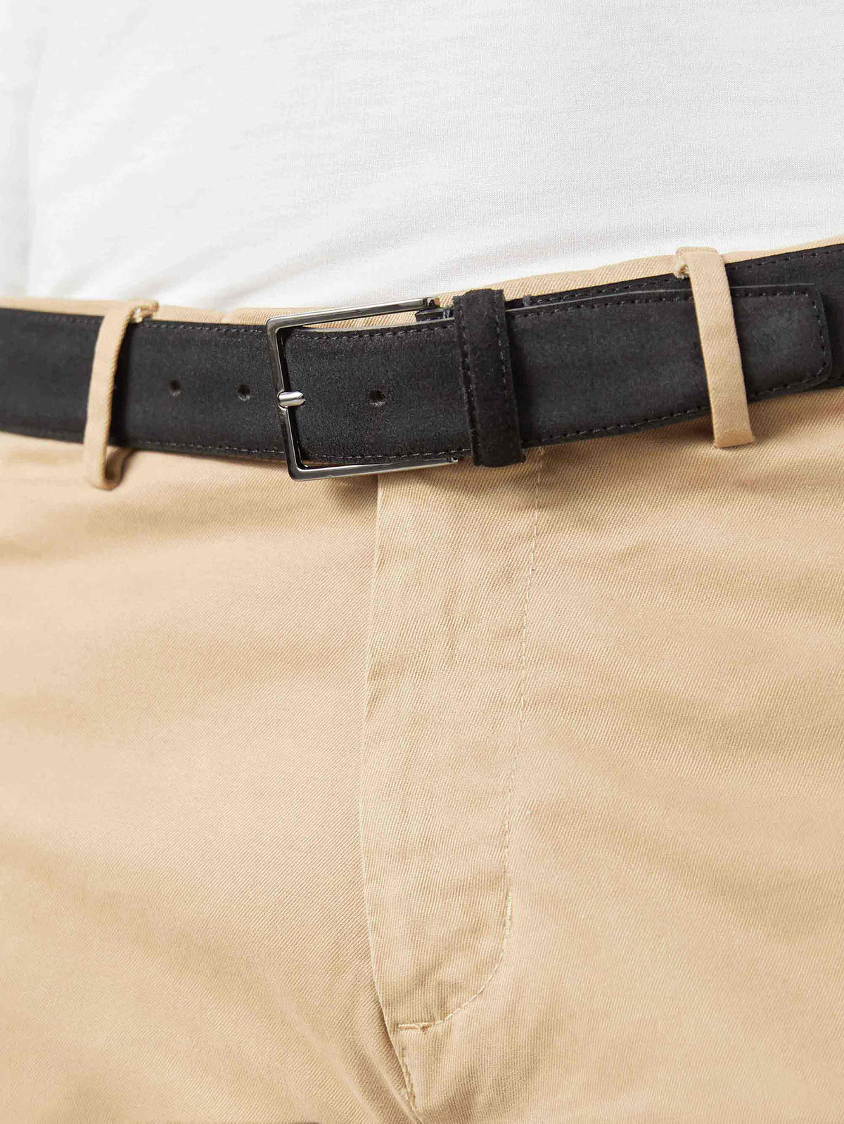 Close-up of a man wearing the Luca Faloni Classic Suede Belt in Black with beige chinos and a white t-shirt.