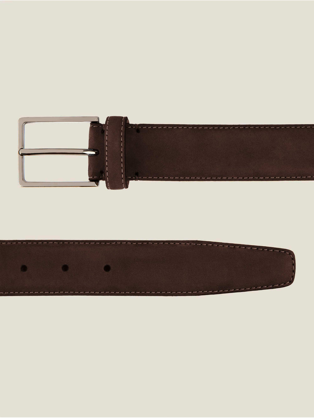 A flat lay image showing a detailed view of the buckle and tip of the Luca Faloni Classic Suede Belt in dark brown.