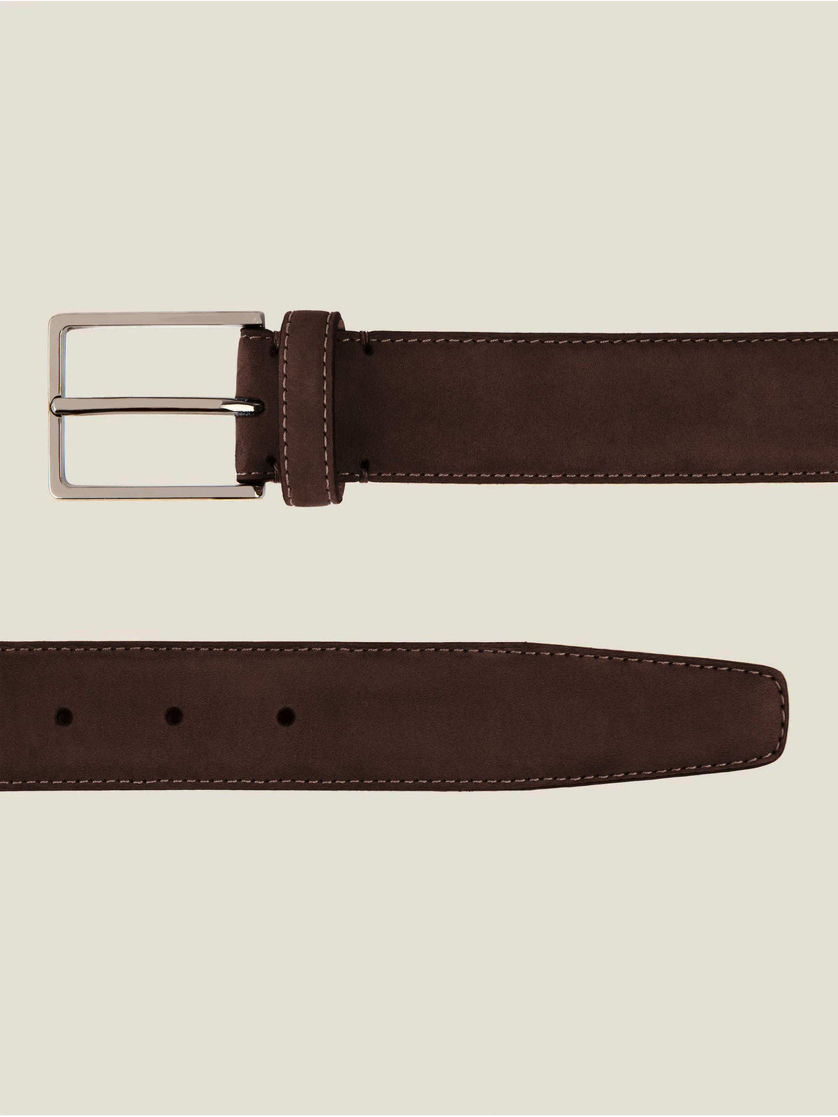 A flat lay image showing a detailed view of the buckle and tip of the Luca Faloni Classic Suede Belt in dark brown.