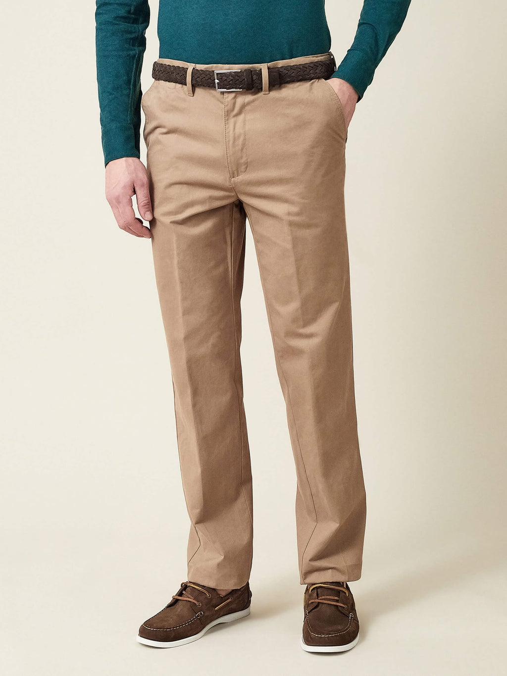 A model wearing the Dark Brown Woven Suede Belt from Luca Faloni, styled with light brown chinos and a teal top.