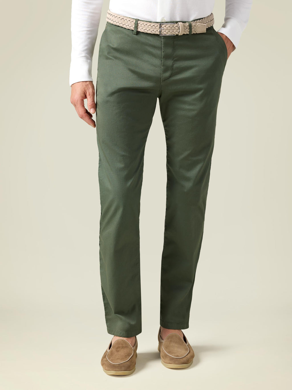 Model from the front wearing the Sand Woven Suede Belt, styled with olive green chinos and a white long-sleeve shirt.