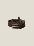 A coiled dark brown woven suede belt with a silver buckle, shown against a plain studio background.