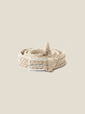 A sand-coloured woven suede belt by Luca Faloni, coiled up to showcase its braided texture and silver-toned buckle.