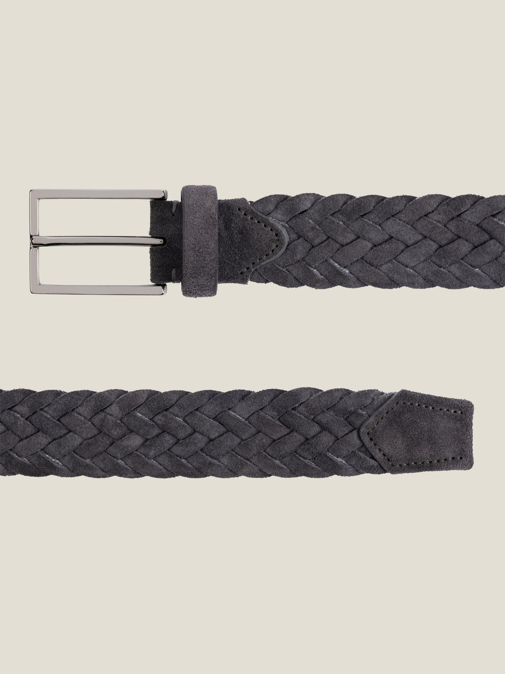 Close-up view of the Luca Faloni Woven Suede Belt in charcoal grey, laid flat against a neutral background.