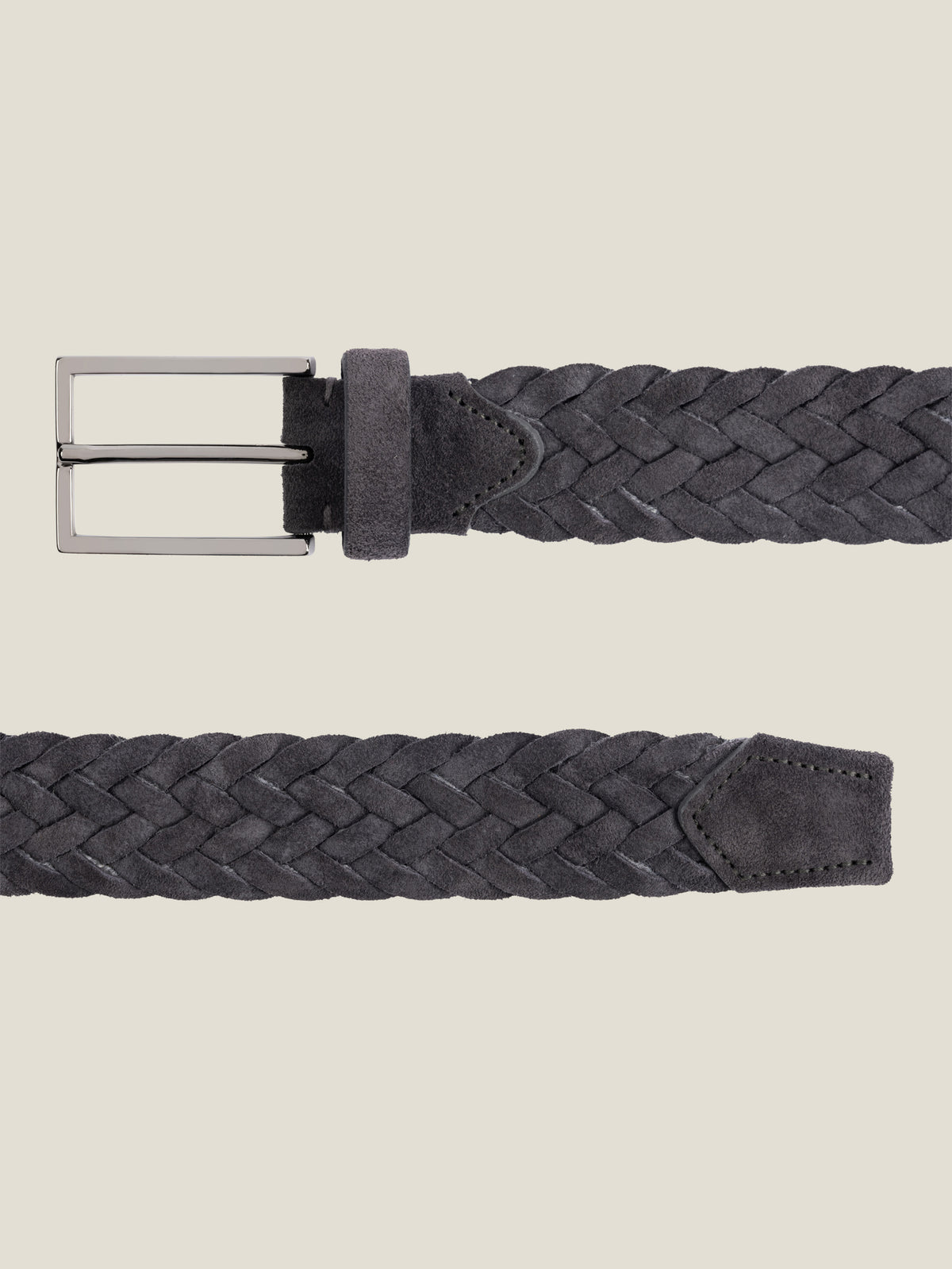 Close-up view of the Luca Faloni Woven Suede Belt in charcoal grey, laid flat against a neutral background.