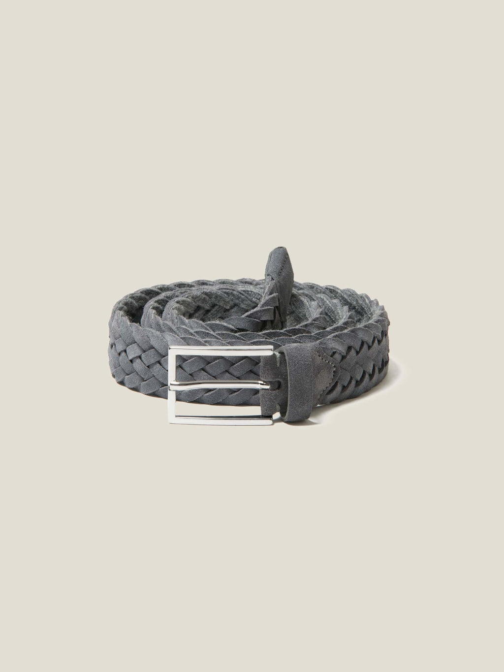 Studio shot of the Luca Faloni grey woven suede belt, coiled to showcase its texture and silver-finished buckle.