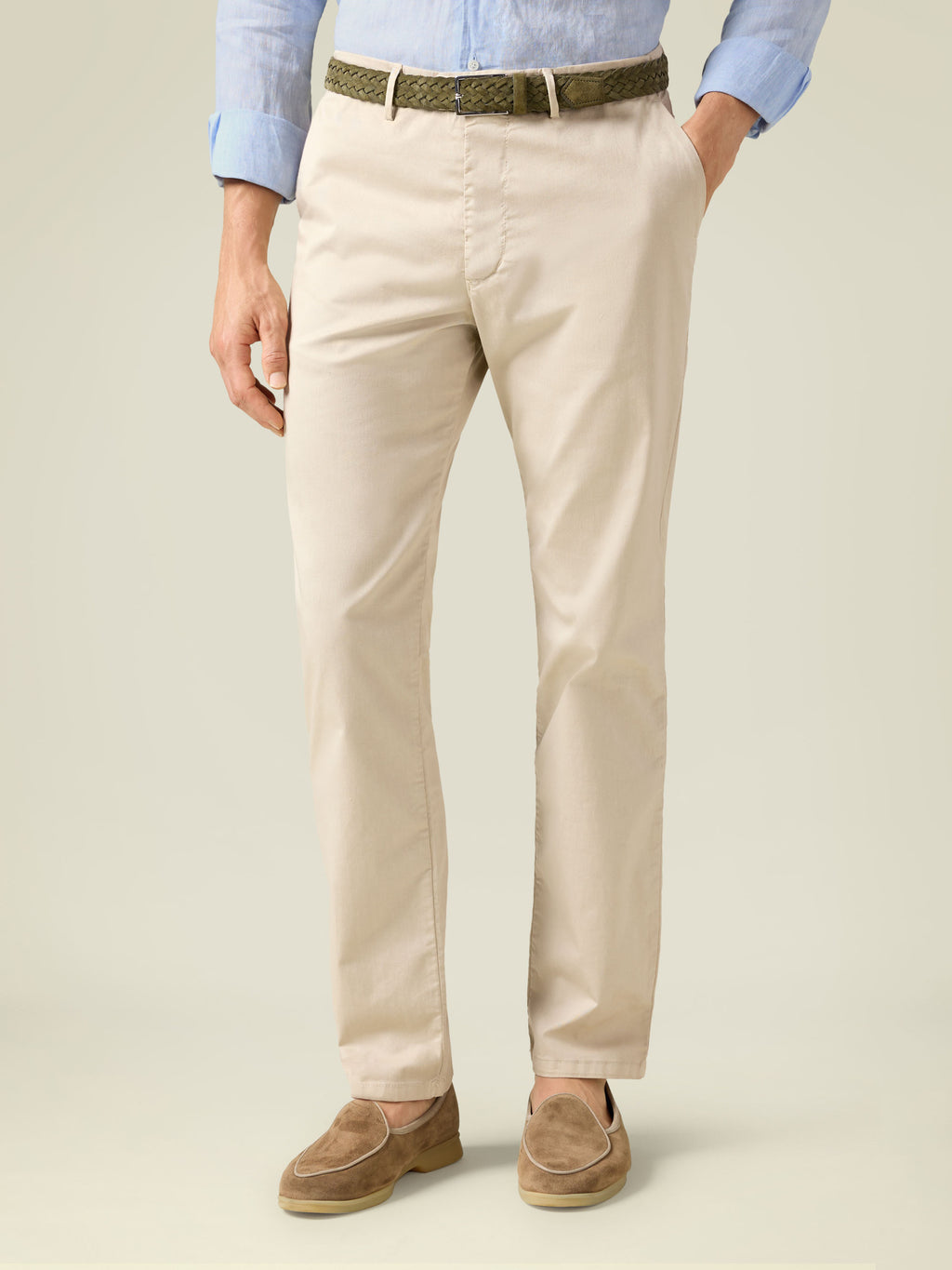A model from the front wearing the Khaki Green Woven Suede Belt with light beige chinos and a light blue shirt.