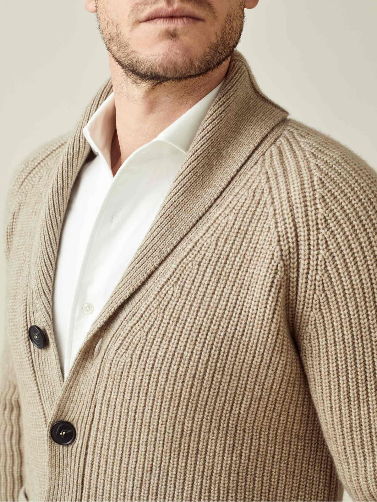 A close-up of the Luca Faloni Chunky Knit Cardigan in Camel Beige, detailing the ribbed texture and shawl collar.