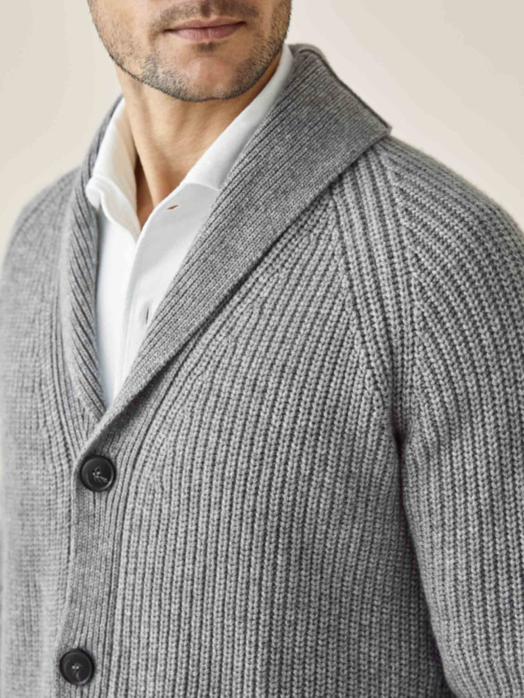 Close-up of a model wearing the Dolomiti Grey Chunky Knit Cardigan, showing the ribbed texture and shawl collar.