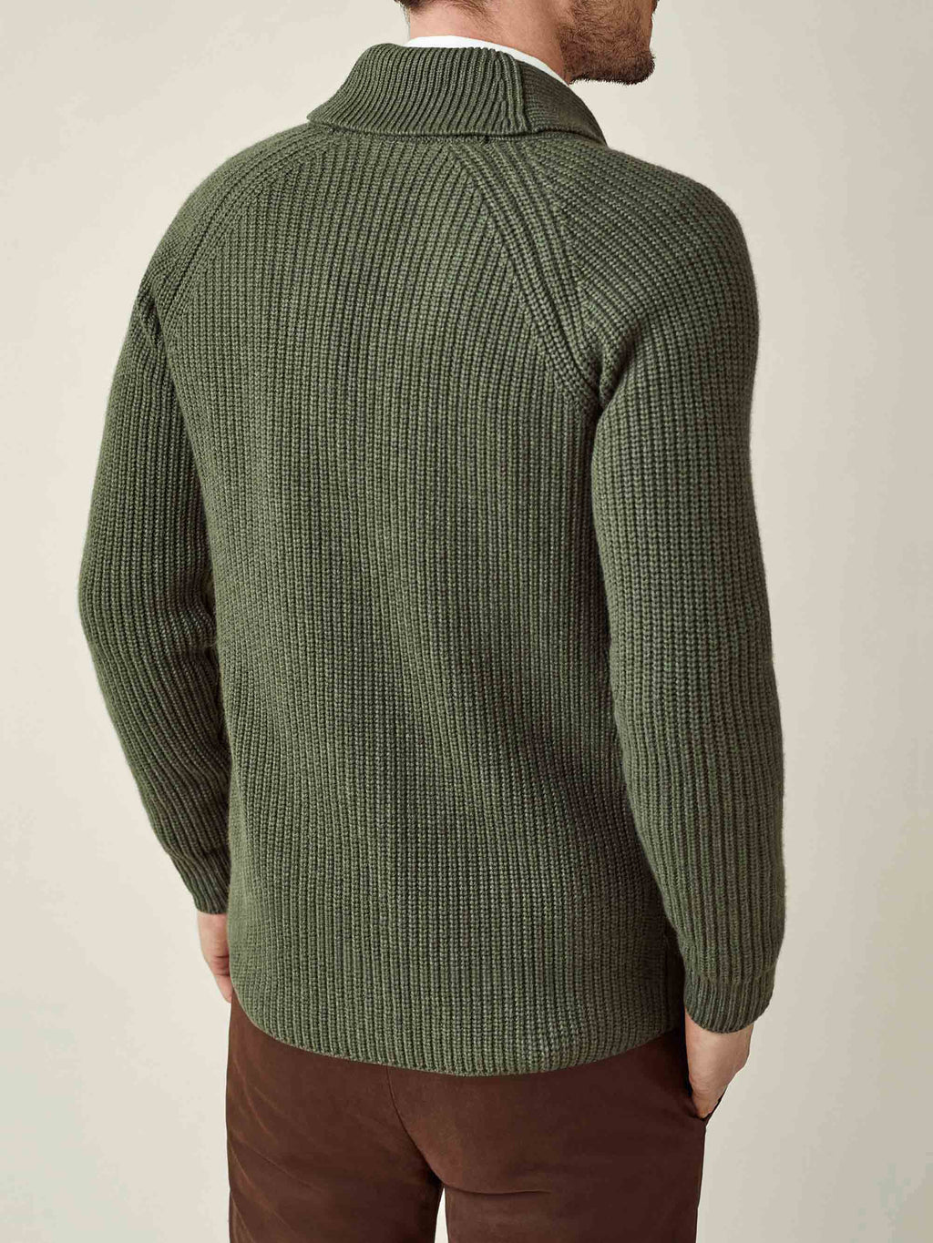 Back view of a man wearing the Chunky Knit Cashmere Cardigan in Hunting Green.