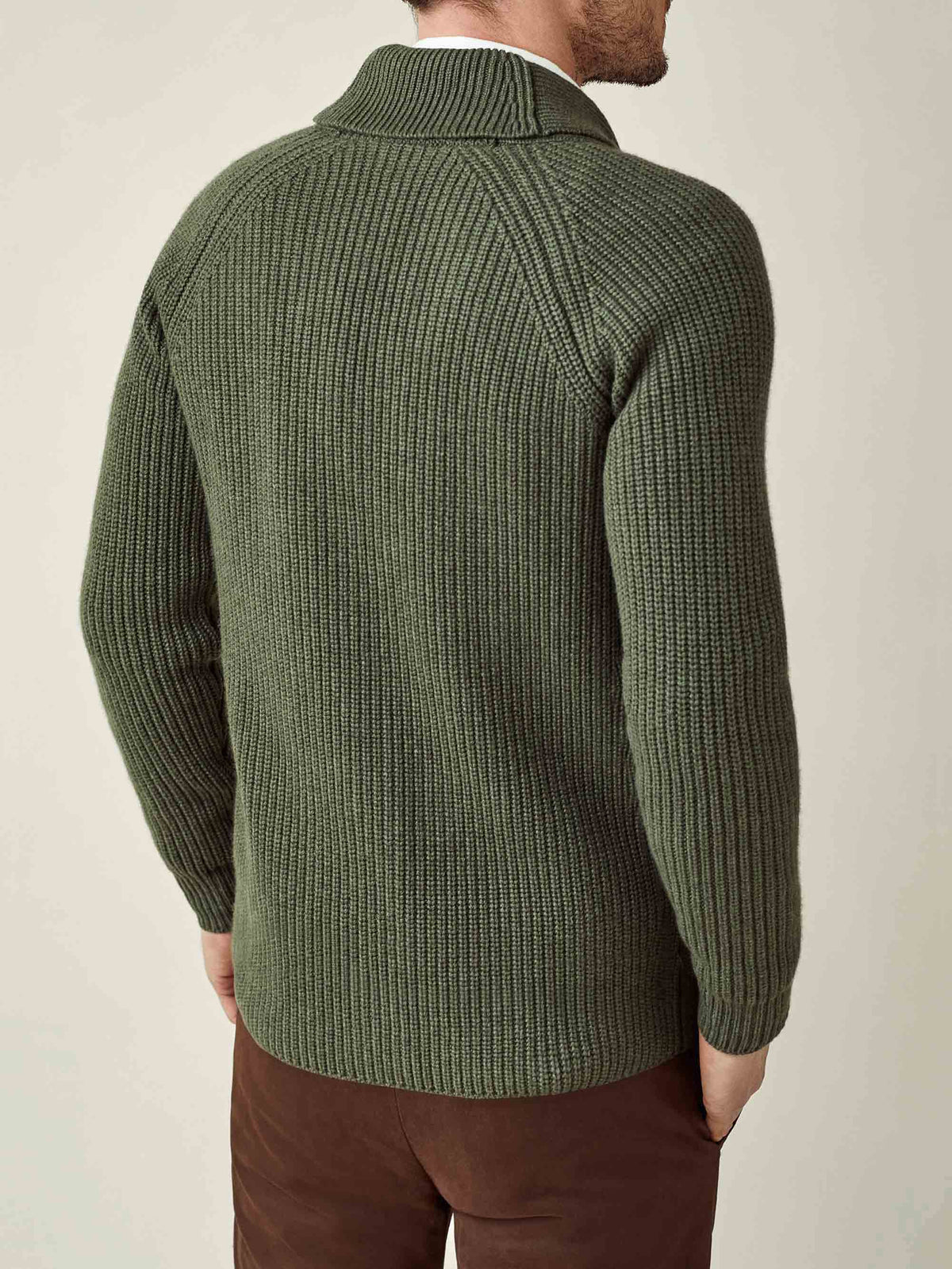 Back view of a man wearing the Chunky Knit Cashmere Cardigan in Hunting Green.