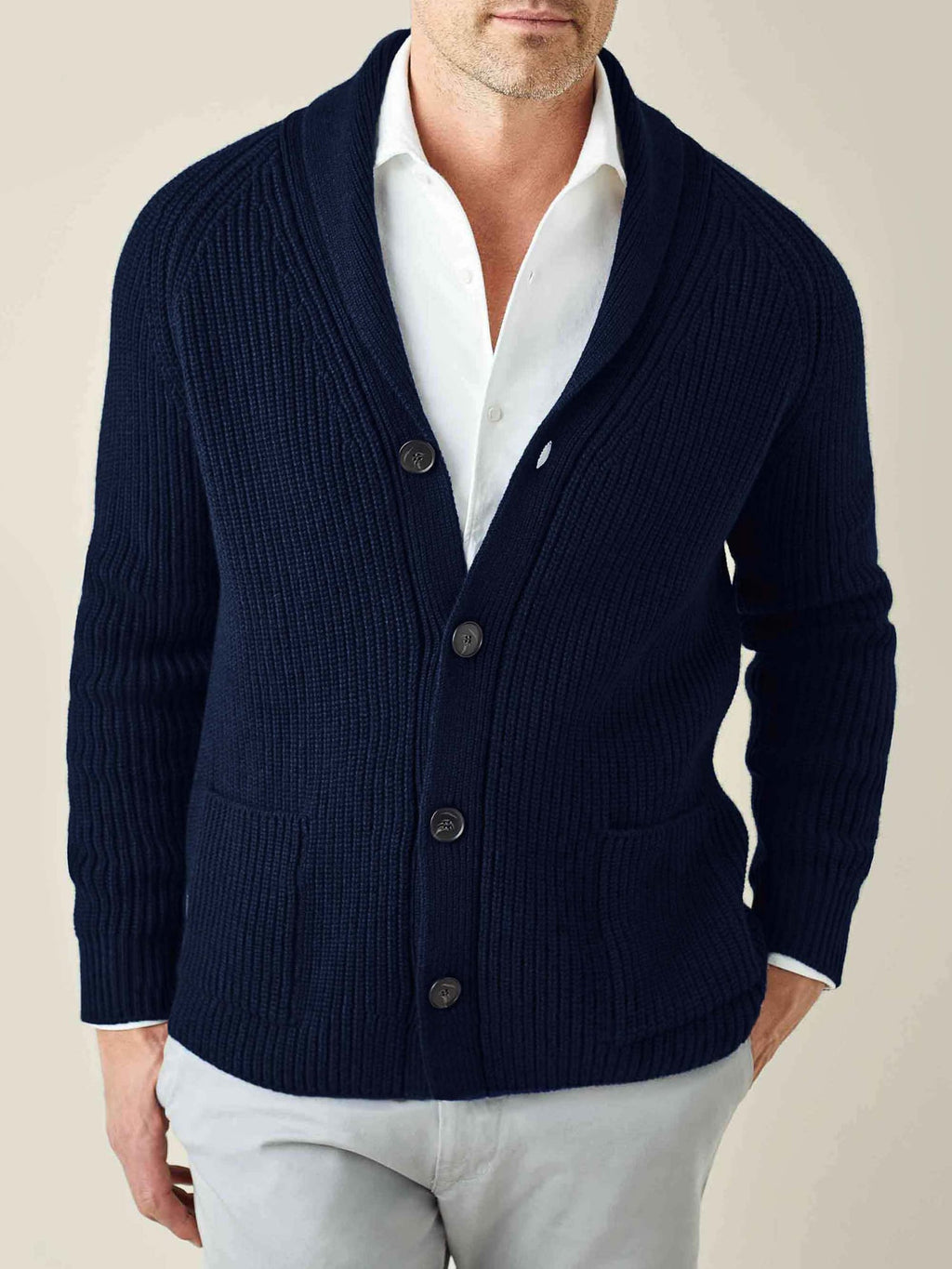 Front view of a man wearing the Midnight Blue Chunky Knit Cashmere Cardigan with a shawl collar, over a white shirt.