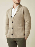 Front view of a man wearing the Chunky Knit Cardigan in Camel Beige, styled with a white shirt and dark green trousers.