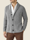 Front view of a man wearing the Luca Faloni chunky knit cashmere cardigan in Dolomiti grey over a white shirt.