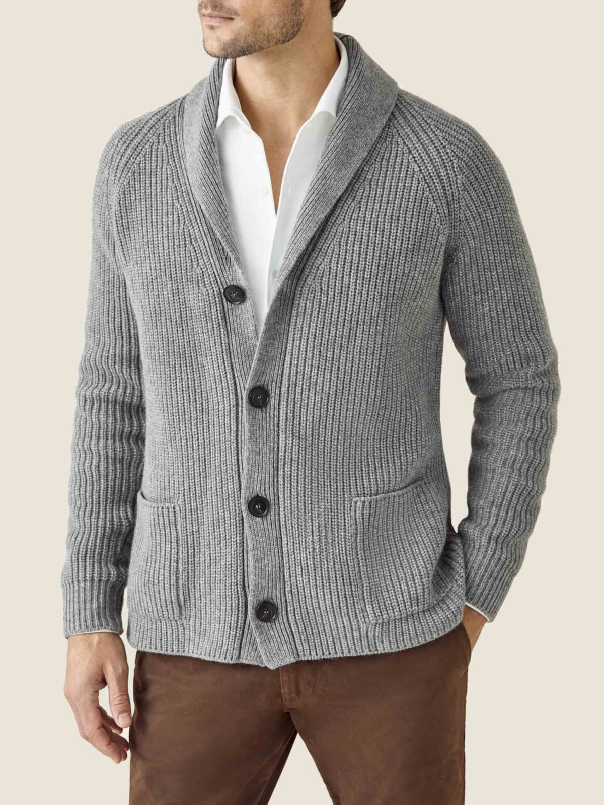 Front view of a man wearing the Luca Faloni chunky knit cashmere cardigan in Dolomiti grey over a white shirt.
