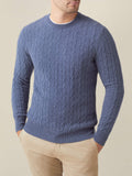 Front view of a model wearing the Sialia Blue Cashmere Cable Knit jumper with light beige chinos.