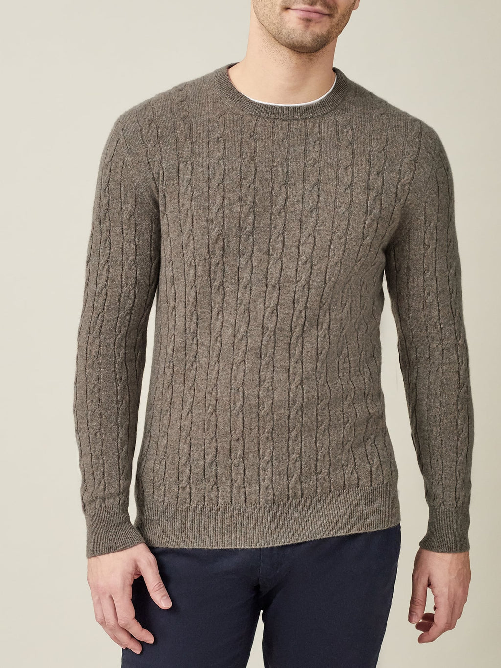 Front view of a man wearing the Luca Faloni Cashmere Cable Knit jumper in Nocciola Brown.