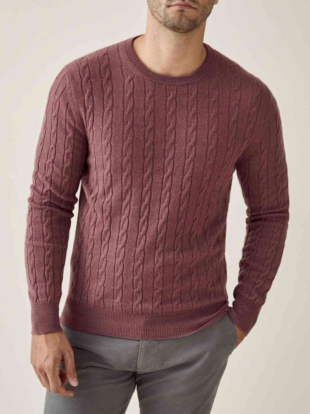 A model wears the Luca Faloni Cable Knit cashmere jumper in Desert Rose.