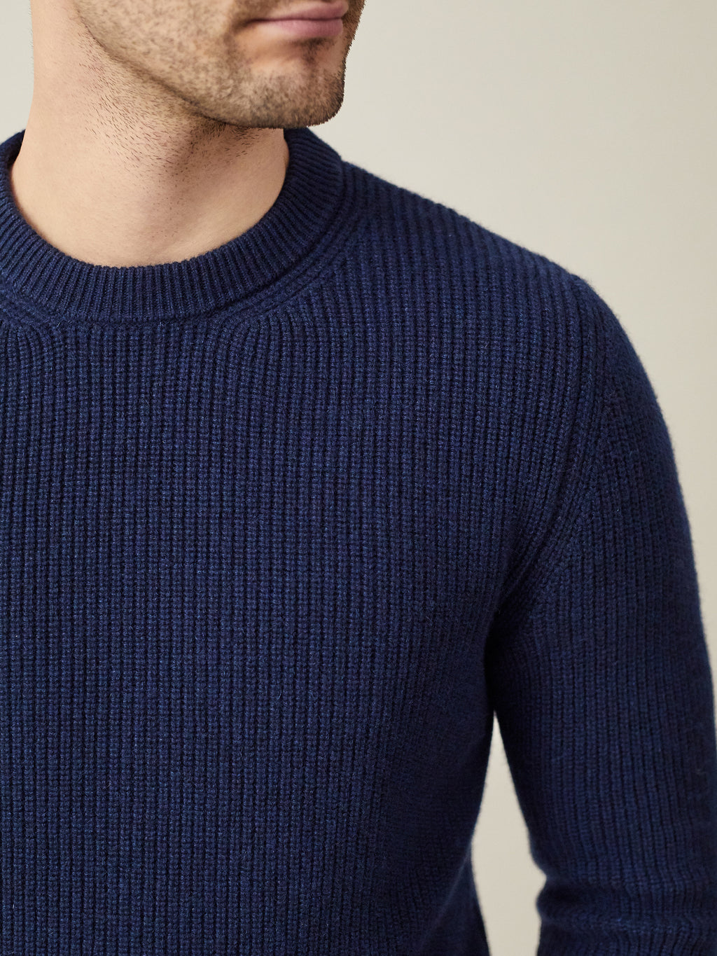 Close-up of the ribbed texture and crew neckline of the Luca Faloni Chunky Knit Cashmere Crew Neck in Midnight Blue.