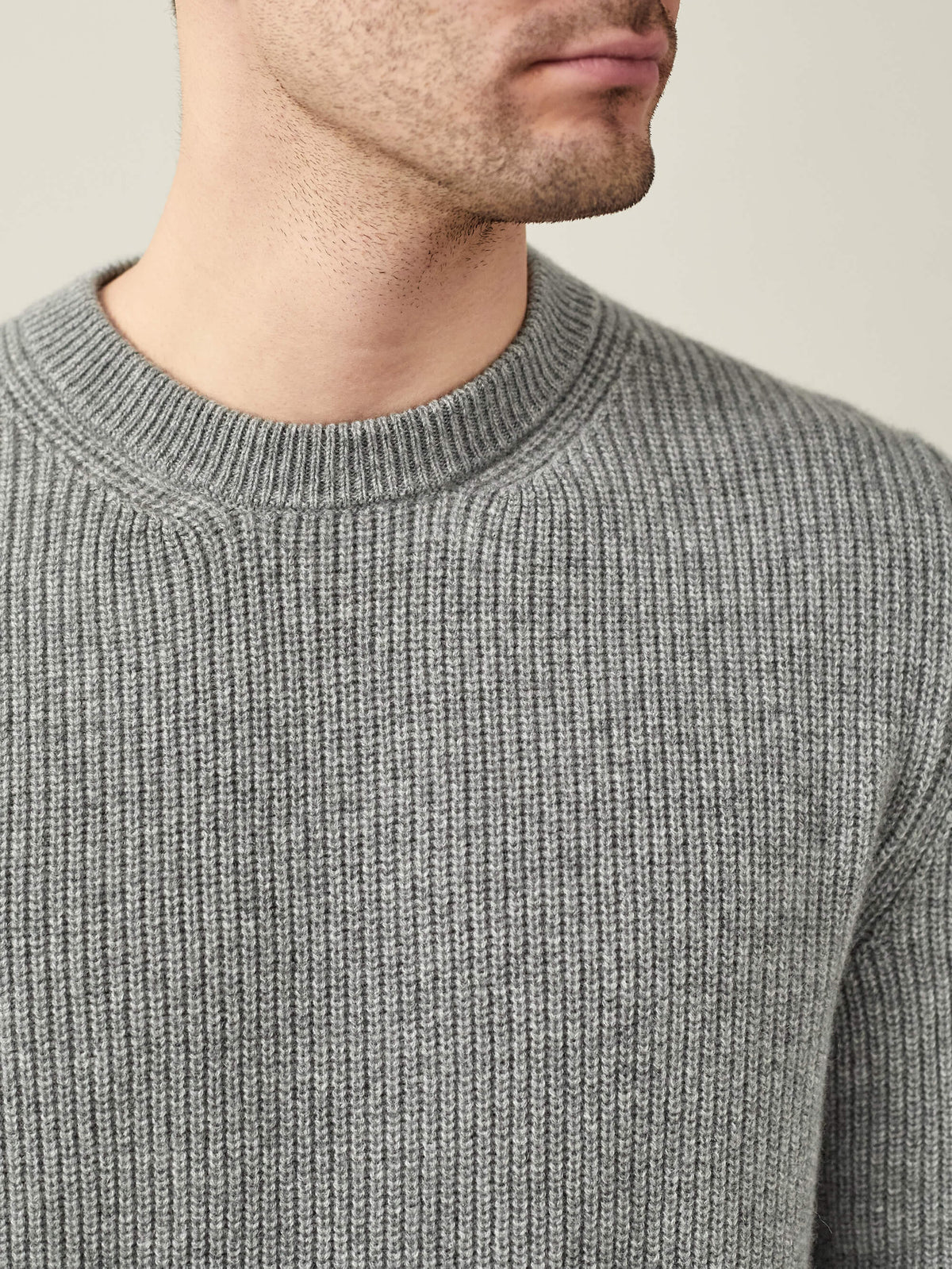 Close-up of a man wearing the Dolomiti Grey Chunky Knit Crew Neck, showcasing the ribbed cashmere texture and neckline.